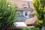 Raffinierte Dachgaube, Balkon und Loggia an einem Zweifamilienhaus in Sexau